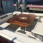 Yacht dining table with teak inlaid design