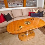 Yacht dining table with carved teak inlaid designs